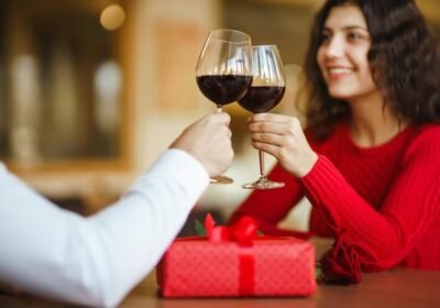 imgi_23_couple-clink-glasses-with-red-wine-lovers-give-each-other-gifts-lovely-romantic-dinner_217236-4653
